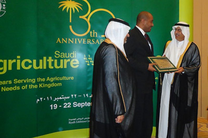 Saudi Arabia: The agricultural minister (right) and Prince Saud Bin Abdallah Al Faisal hand over the anniversary award to Khalid Abdelrahman.