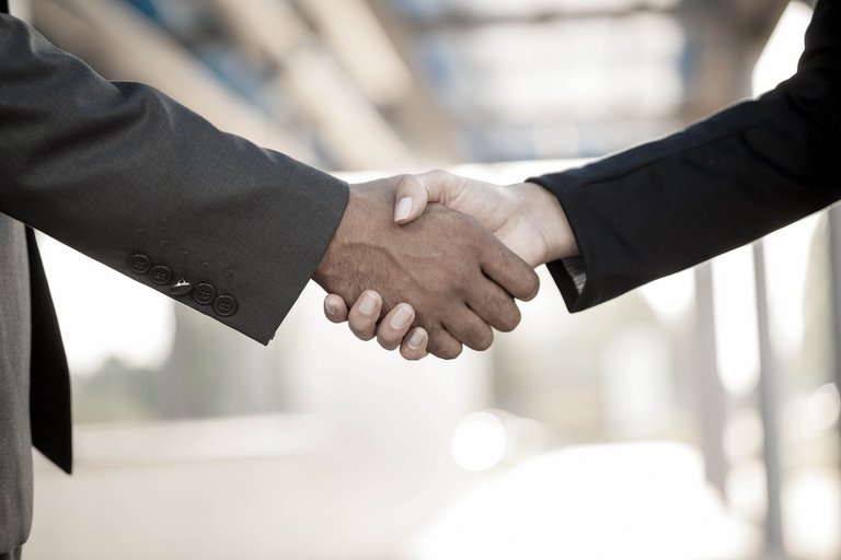 Handshake,blurry background Handshake,blurry background